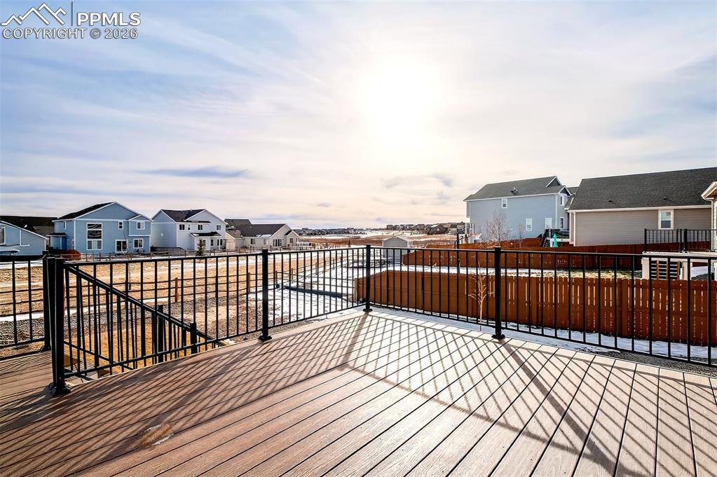 Image 39 of 41: Open space and a walking path behind this home.