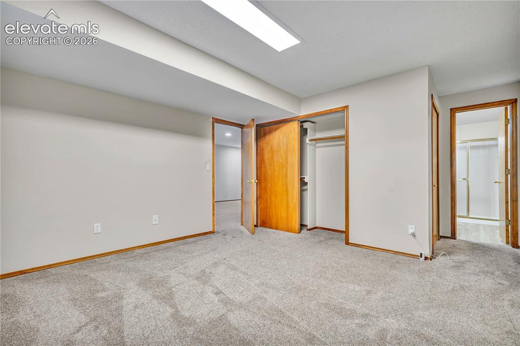 Image 37 of 46: Basement bedroom