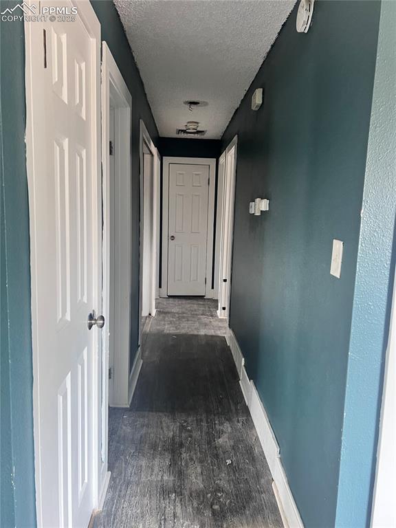 Image 13 of 17: Hallway to bedrooms