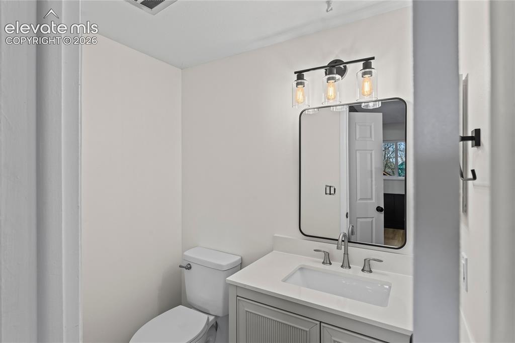 Image 23 of 49: Lower level powder room
