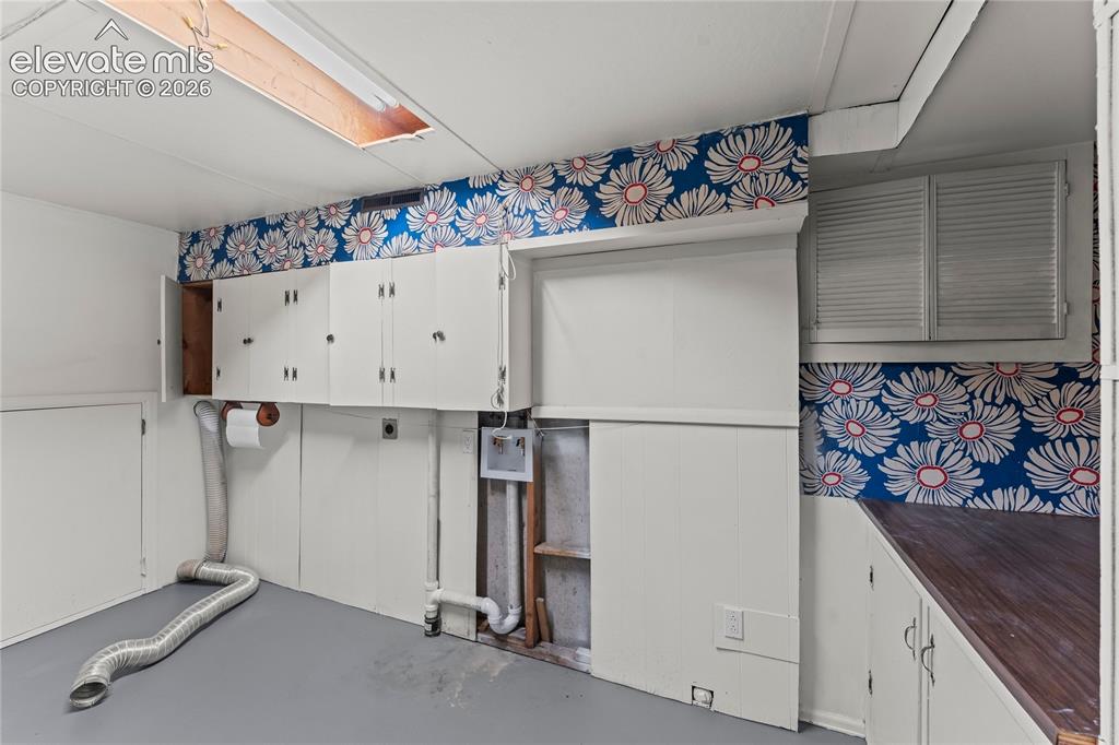 Image 38 of 49: Basement laundry area