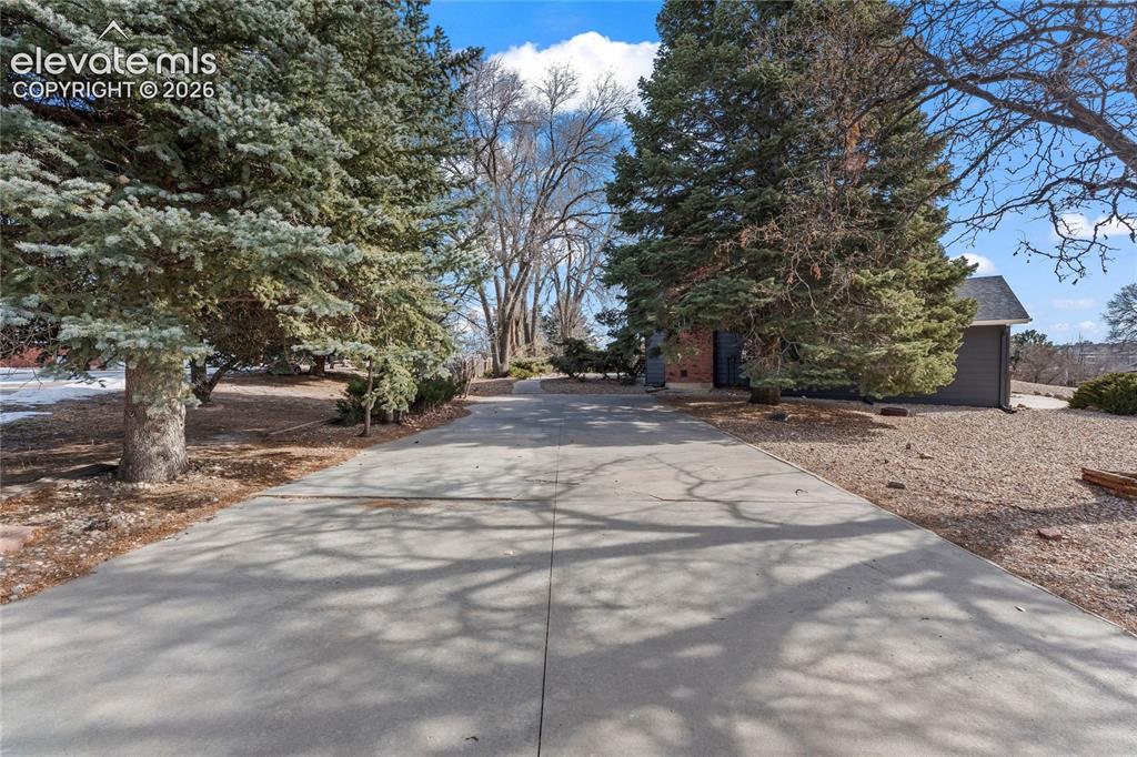 Image 42 of 49: 2nd driveway backyard 