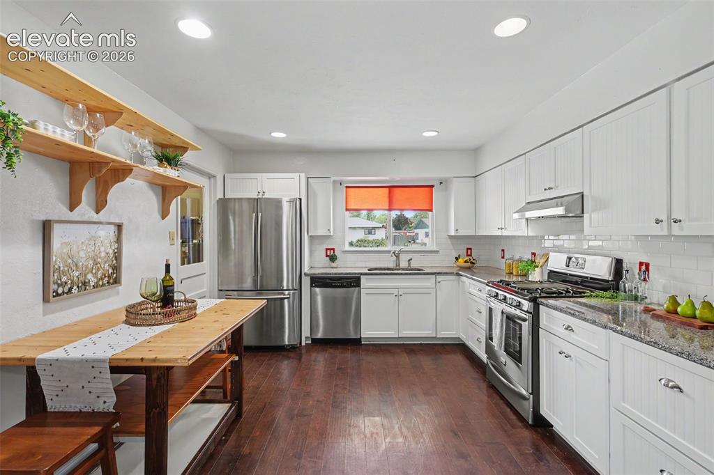 Image 10 of 36: Kitchen with all stainless steel appliances.