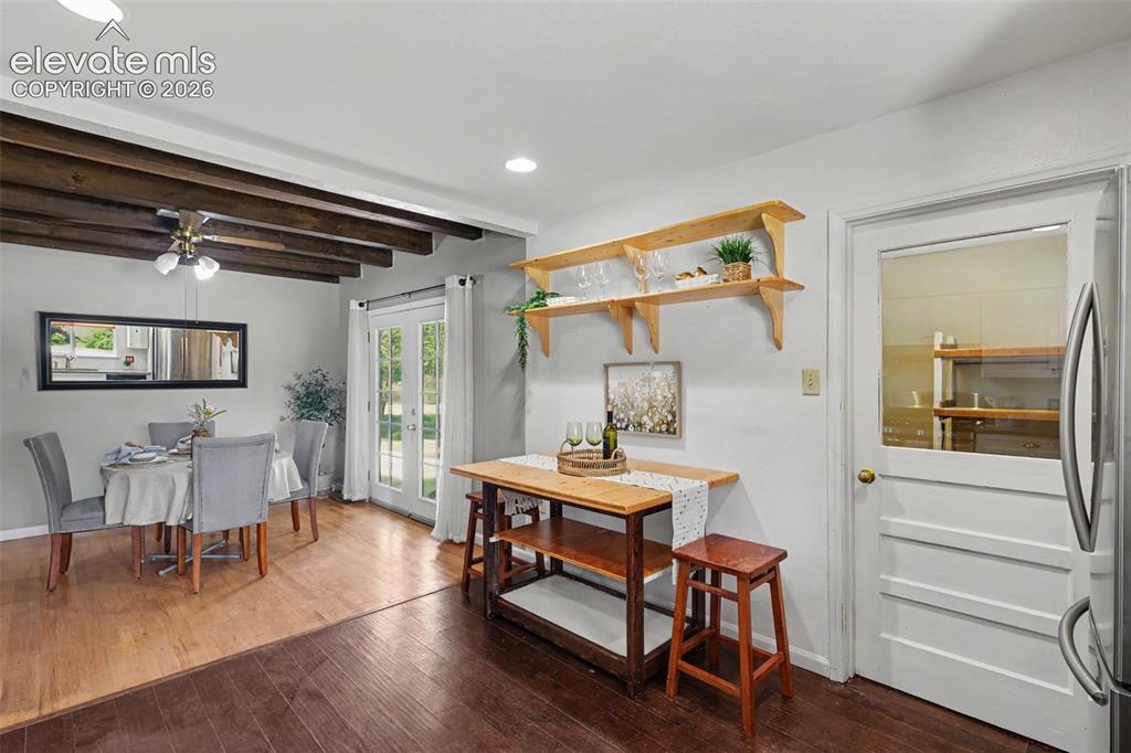 Image 13 of 36: Kitchen with view into dining area.