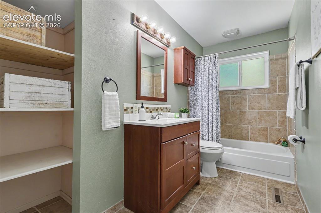 Image 28 of 36: Remodeled full bathroom.