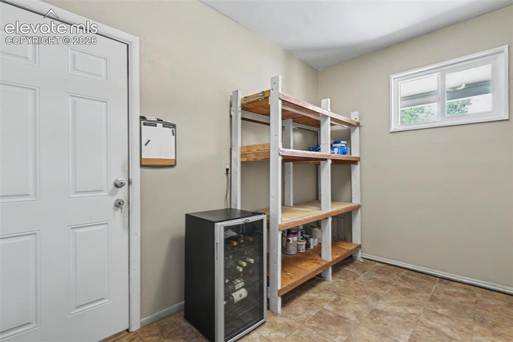 Image 30 of 36: Laundry includes pantry shelving