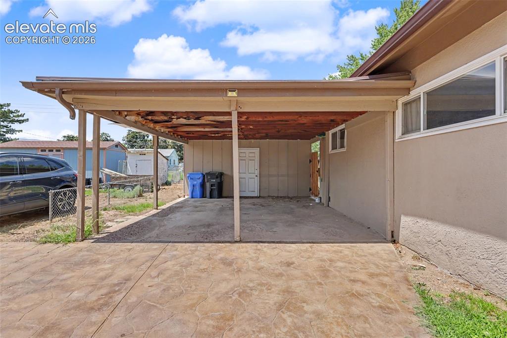 Image 32 of 36: 2-car carport
