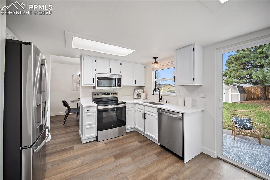 Image 10 of 25: Convenient Access To Kitchen and Living Room