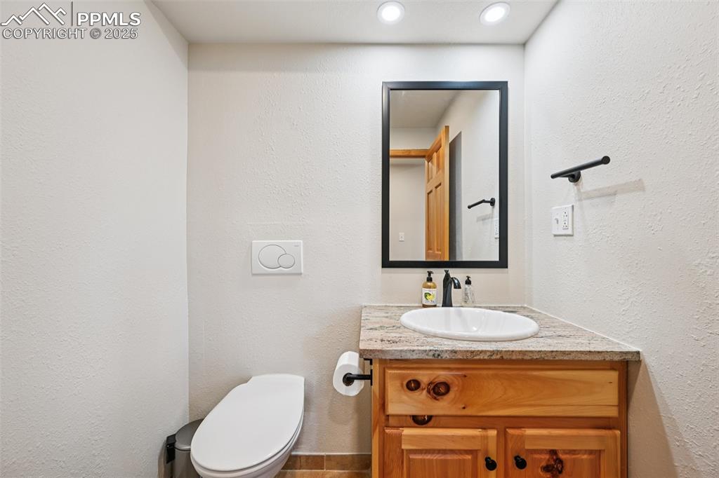 Image 20 of 50: Half bathroom on the main level