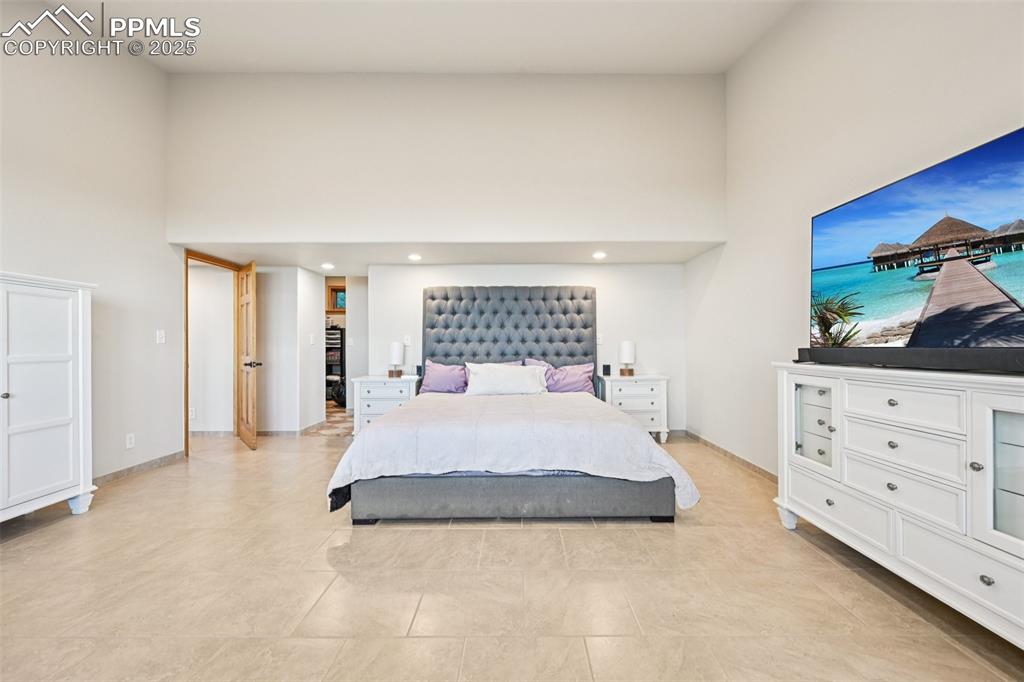 Image 22 of 50: Primary bedroom with its own private walk out, en suite 5 piece bathroom, s