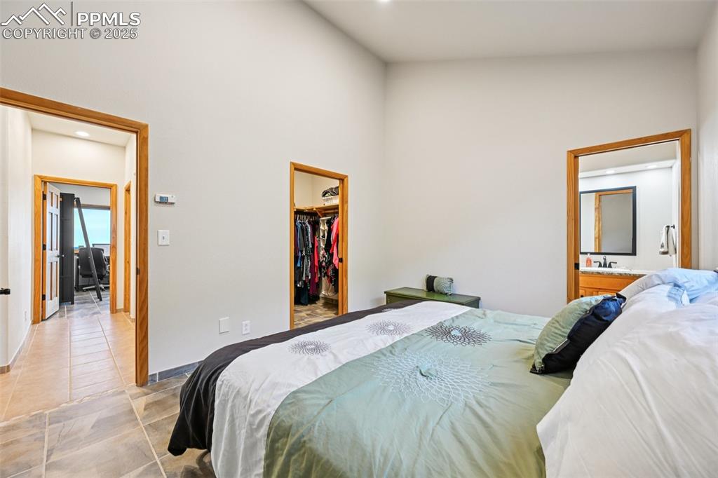 Image 31 of 50: bedroom 3 with walk in closet and en suite full bathroom