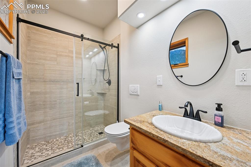 Image 37 of 50: 3/4 bathroom off bedroom 4