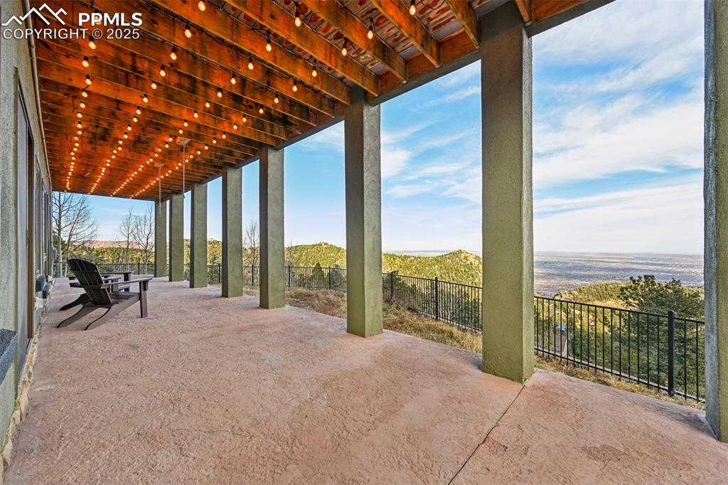 Image 41 of 50: Covered patio off the lower level with dog run