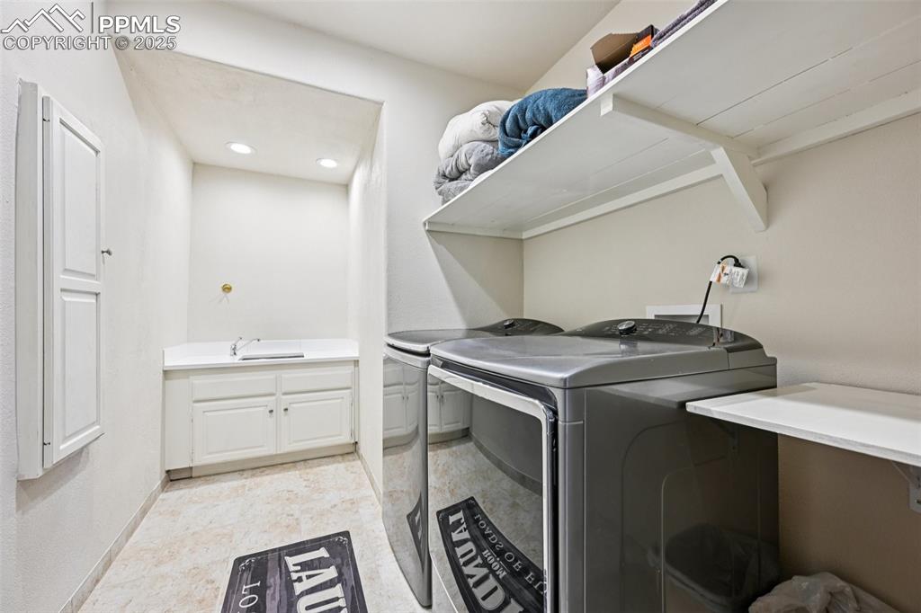 Image 44 of 50: Laundry room with laundry shoot