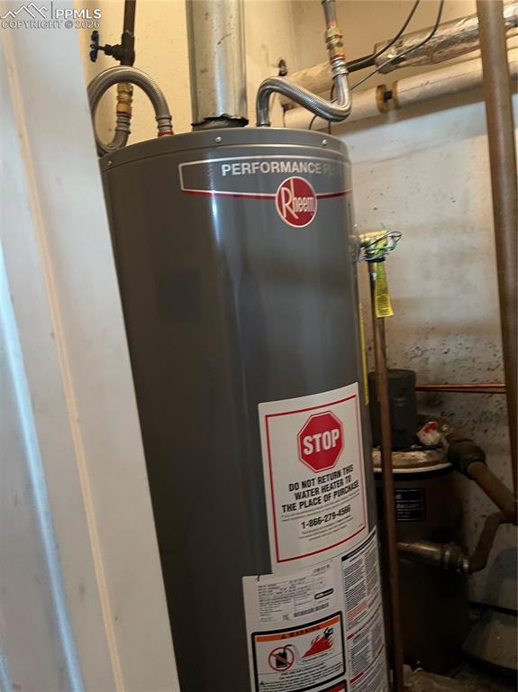 Image 8 of 11: Utilities featuring water heater