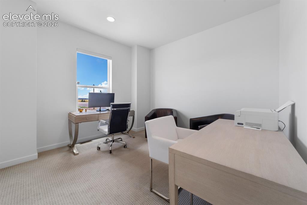 Image 26 of 38: Dedicated room with light-toned wall finishes