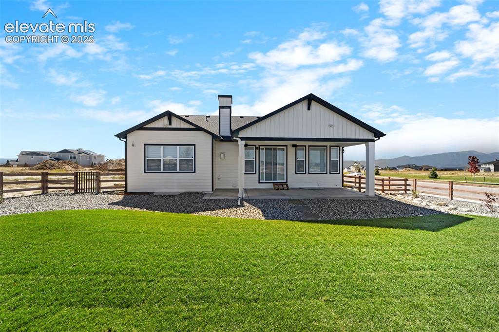 Image 5 of 38: Contemporary exterior with white siding and dark trim