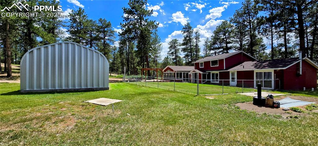 Image 11 of 48: View of yard featuring a shed