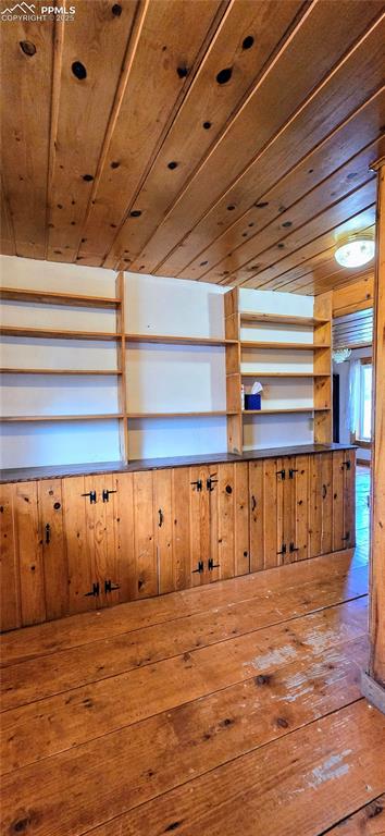 Image 19 of 48: Misc room with wooden ceiling, hardwood / wood-style flooring, and wooden w