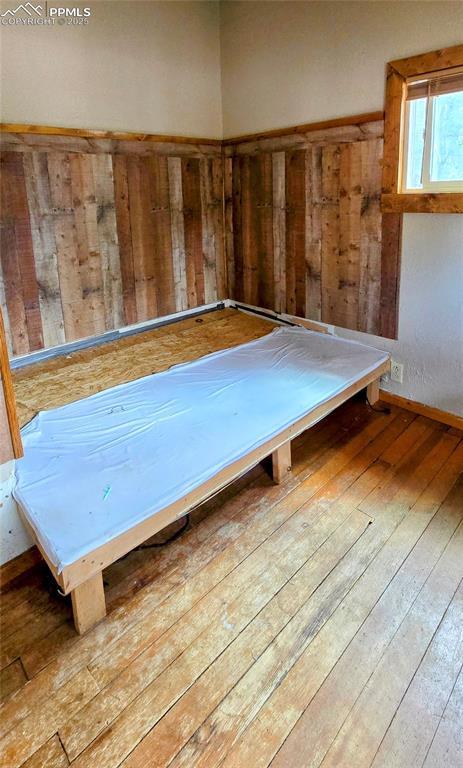 Image 42 of 48: Miscellaneous room with wood-type flooring