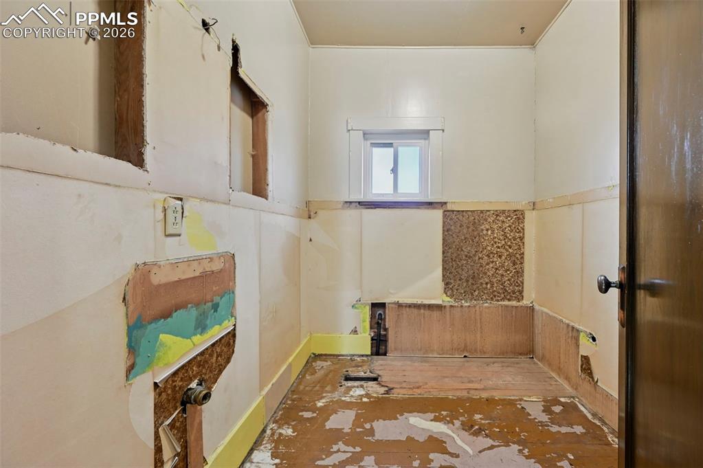Image 25 of 39: Unfinished bathroom, was used as a closet.