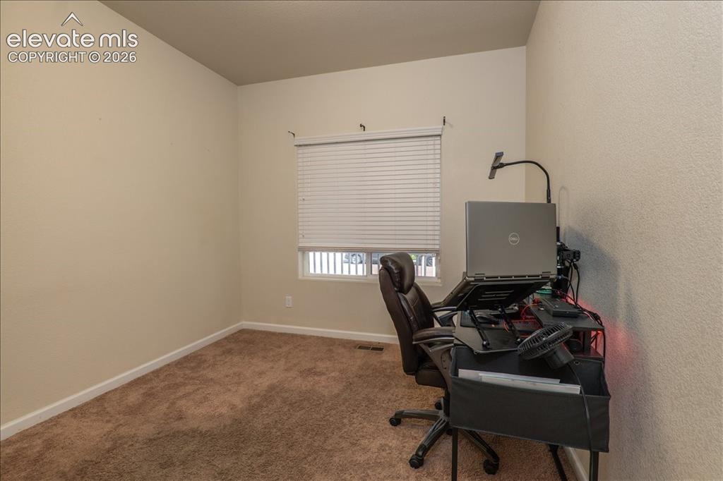 Image 10 of 50: Main level, next to the bathroom, down the hall from front door off of side