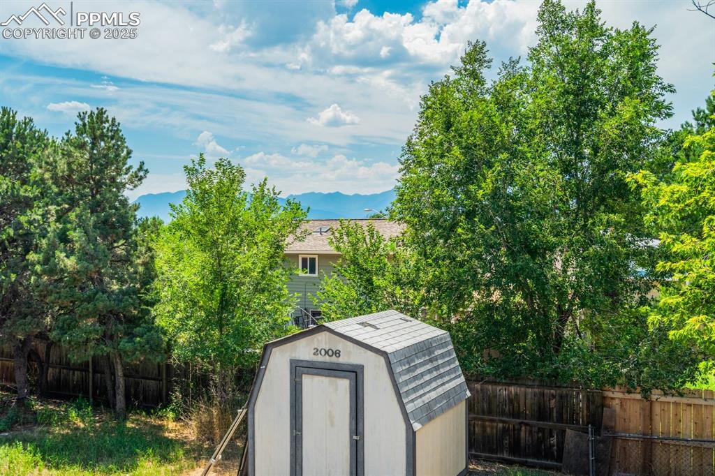 Image 12 of 37: View of shed with a mountain view