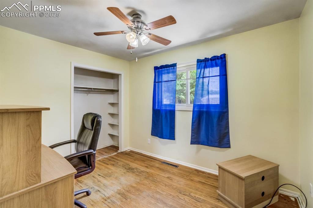 Image 16 of 37: Unfurnished office with wood finished floors and ceiling fan