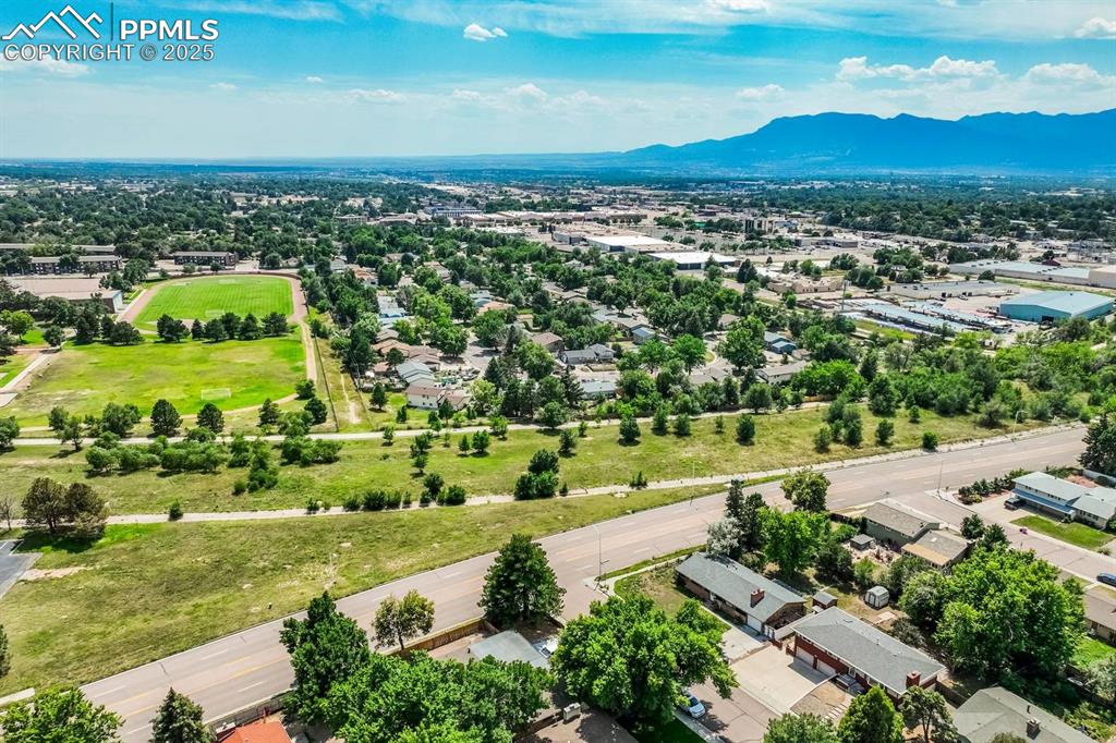 Image 37 of 37: Aerial view of residential area with mountains