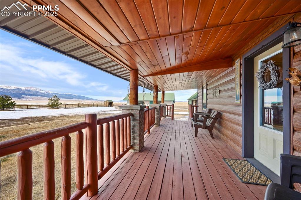 Image 15 of 50: Wooden deck featuring a mountain view