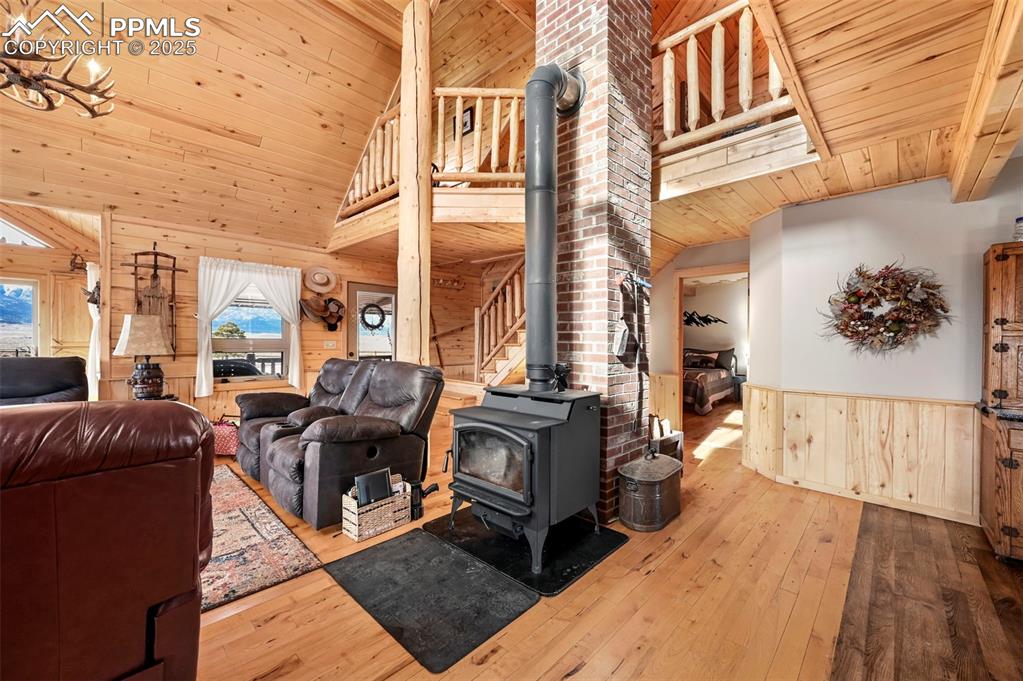 Image 27 of 50: Living area featuring wooden ceiling, hardwood / wood-style flooring, woode