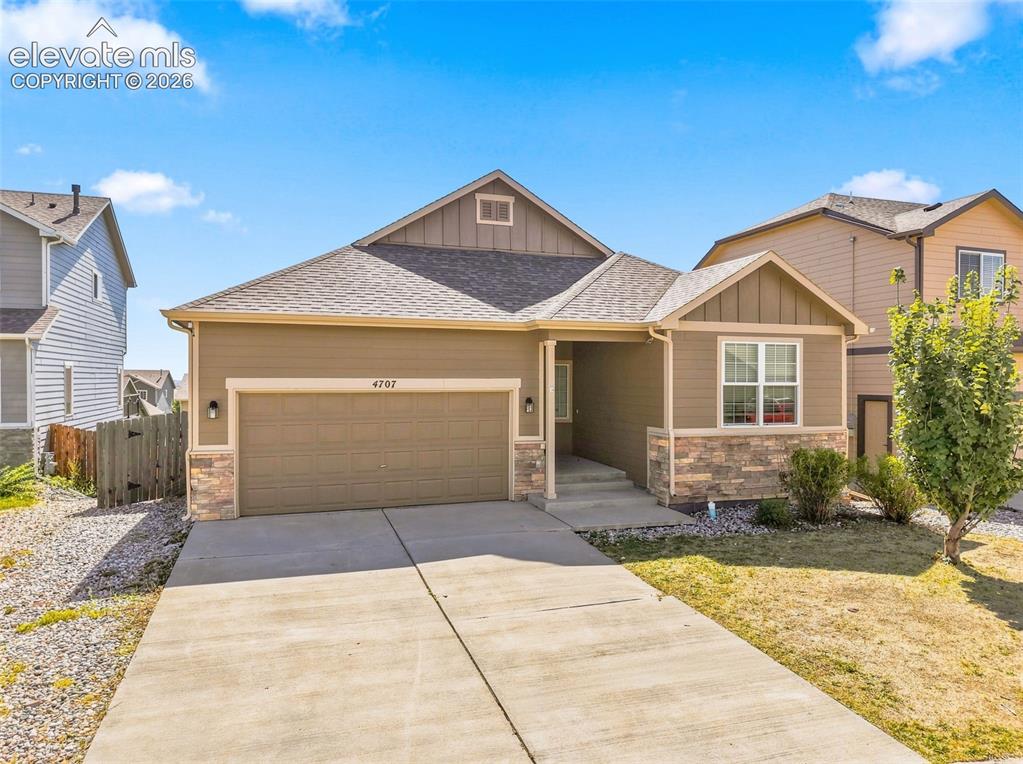 Image 1 of 31: Exterior featuring a concrete driveway, attached garage, stone accents, and