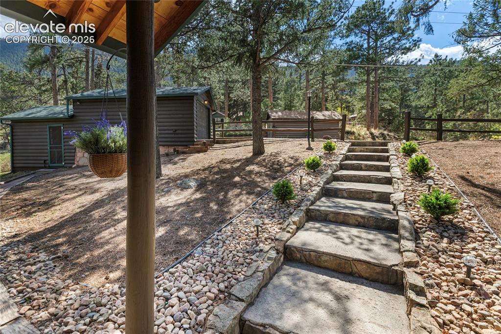 Image 11 of 38: The front yard is open and spacious...and you even have a one car garage an