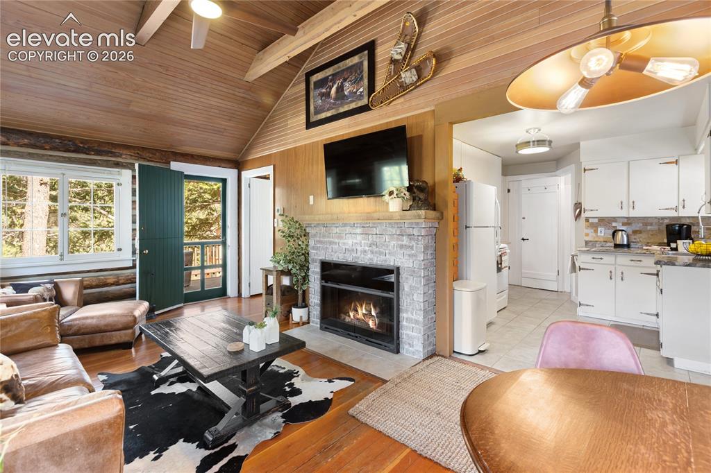 Image 13 of 38: Vaulted ceilings, vintage chinking and a real log interior..with nice updat