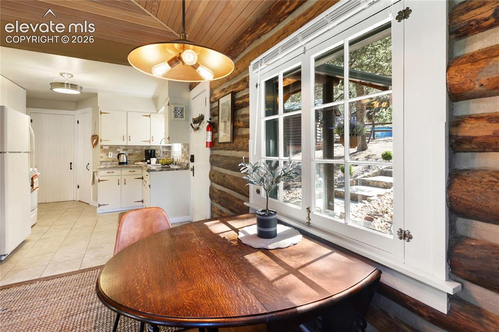 Image 16 of 38: A great dining space that connects the kitchen and living room---look at th