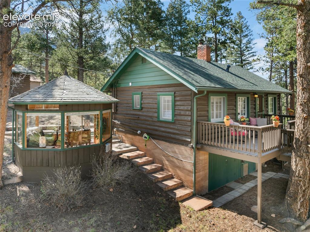 Image 9 of 38: You can access the backyard via side steps or via the deck...and don