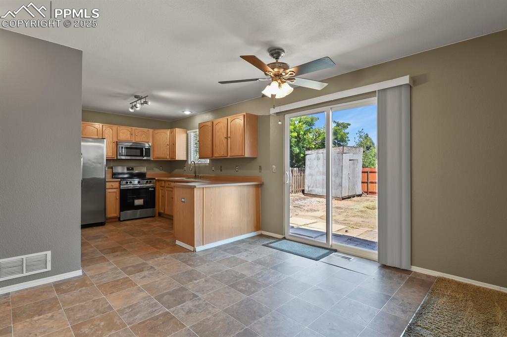 Image 12 of 35: Dining area adjacent to the kitchen.