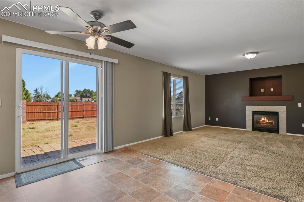 Image 15 of 35: Patio doors off the dining area, living room