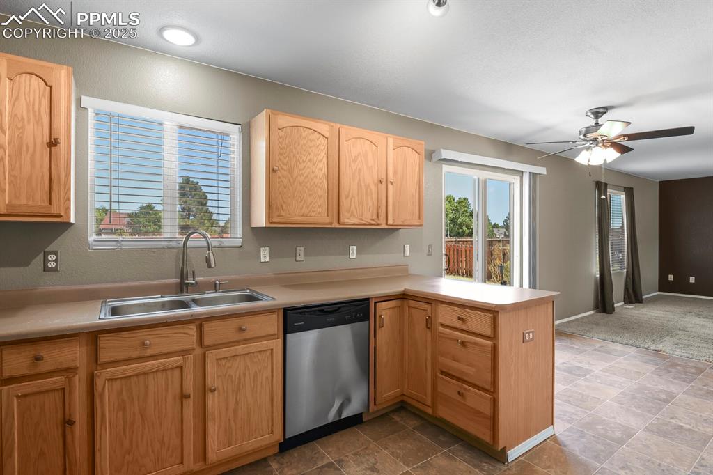 Image 18 of 35: Kitchen looking towards the living room - plenty of natural light
