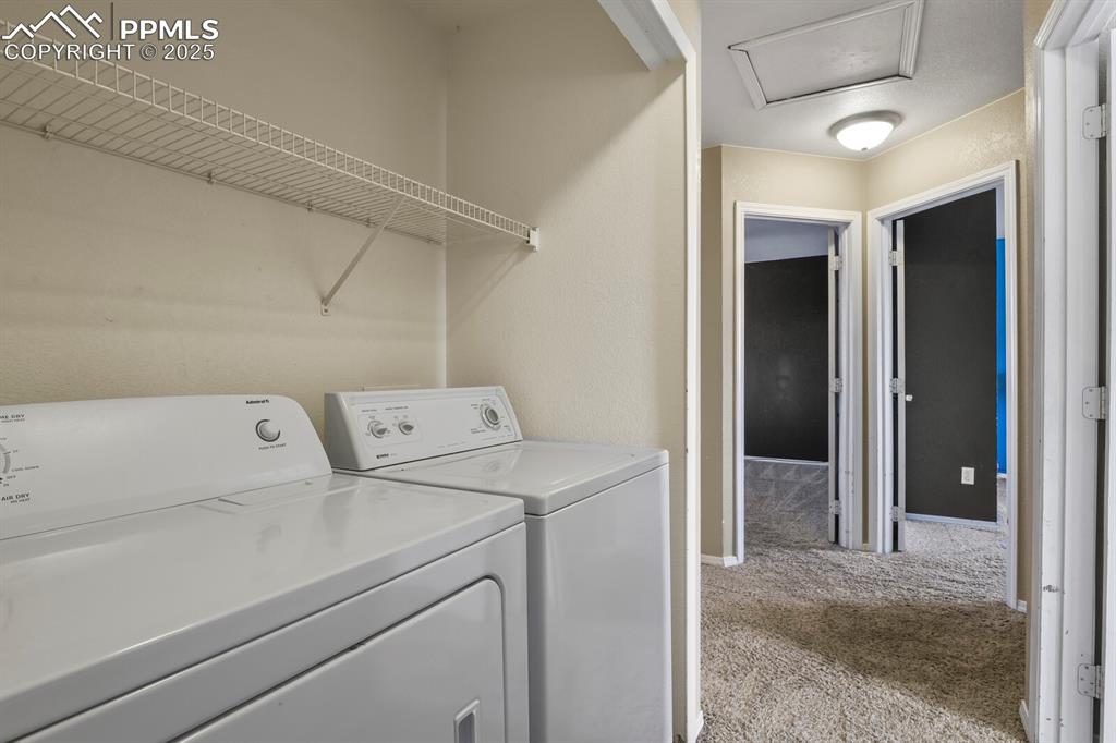 Image 31 of 35: Laundry area featuring washer and dryer