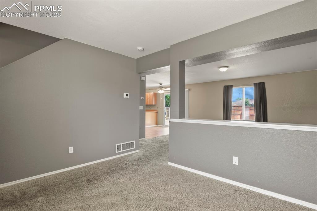 Image 7 of 35: Living Room looking toward dining area/famly room.