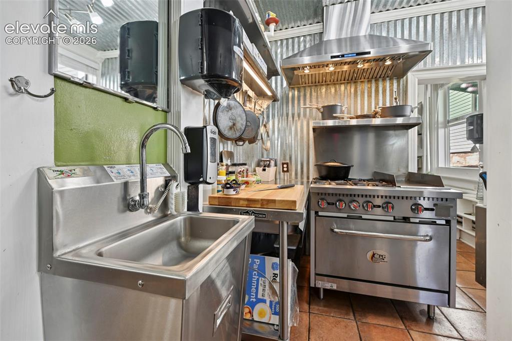 Image 12 of 50: Handwashing Station and Cook Area