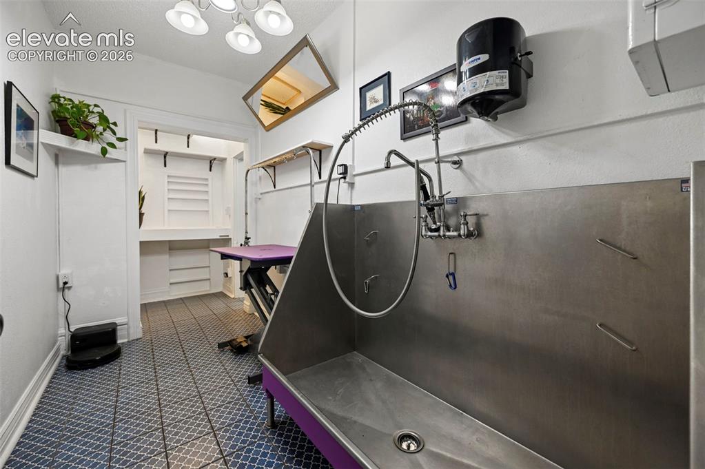 Image 18 of 50: Pet Area with built ins and work station