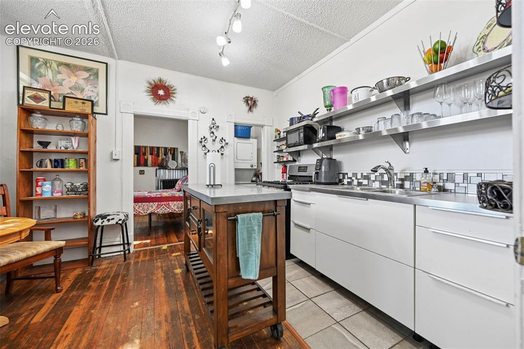 Image 40 of 50: Apartment Kitchen & Laundry Closet