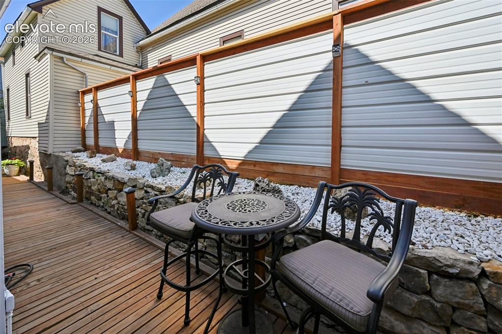 Image 47 of 50: Kitchen Side Patio