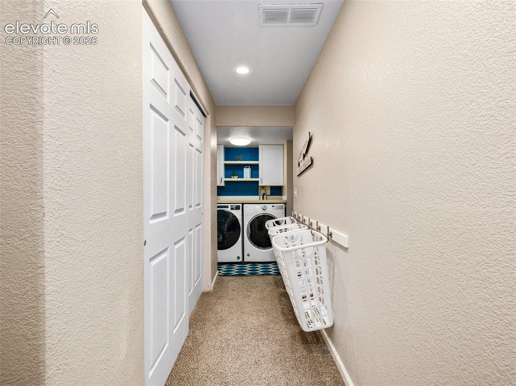 Image 26 of 50: There is an additional laundry hook up in the kitchen pantry
