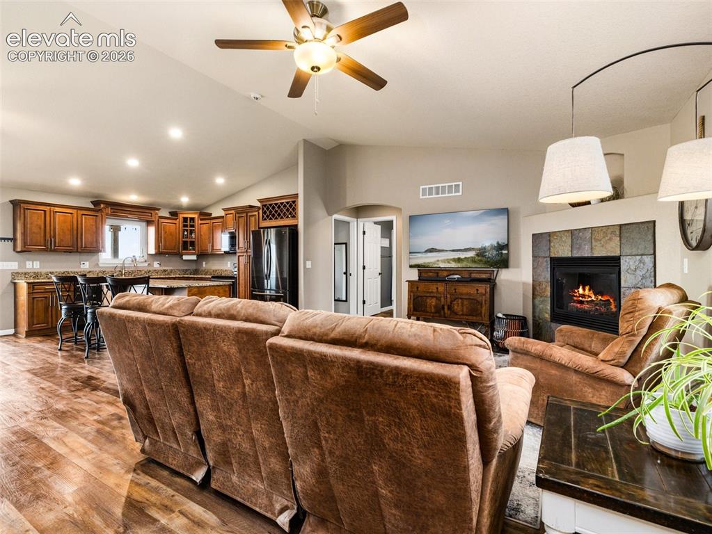 Image 5 of 50: View of the open floor plan and vaulted ceilings