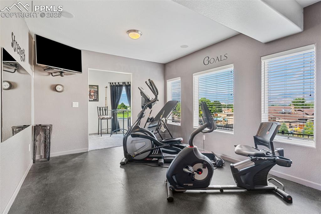 Image 37 of 44: Exercise room with attached bathroom 