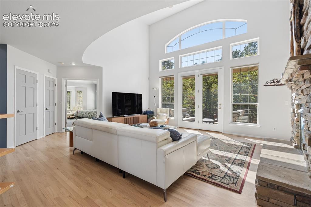 Image 5 of 50: Vaulted ceilings, floor-to-ceiling multi-pane windows, arched transom windo