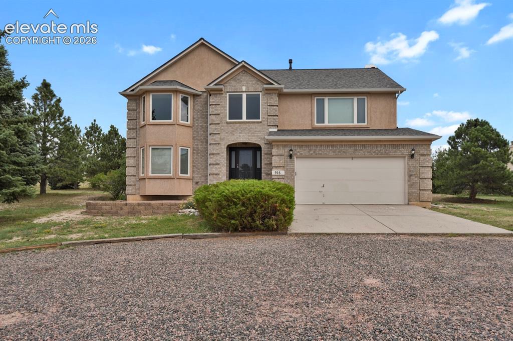 Caption: Low maintenance exterior with brick & stucco
